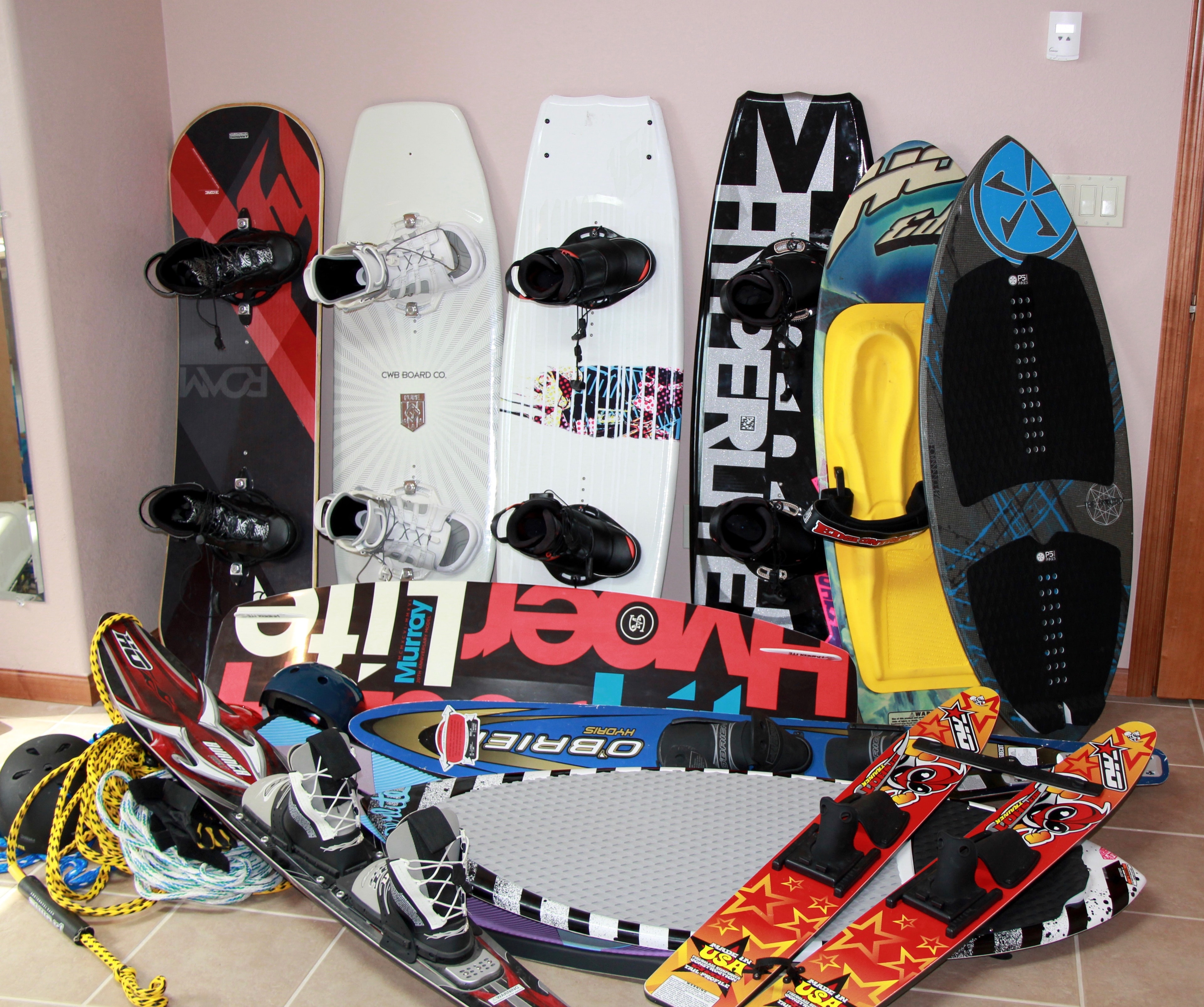 Water sports equipment piled and disorganized before the H2Organizer